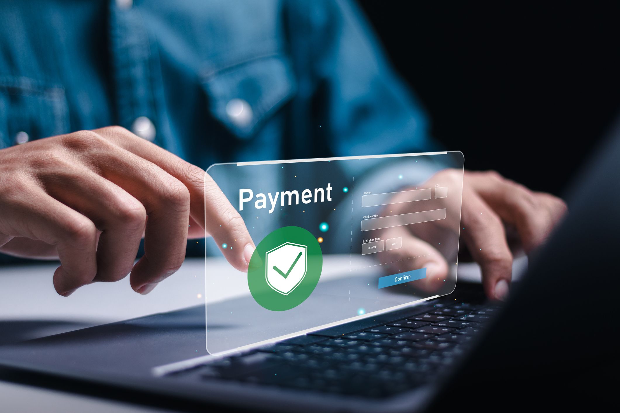 Hand using laptop to make online payment