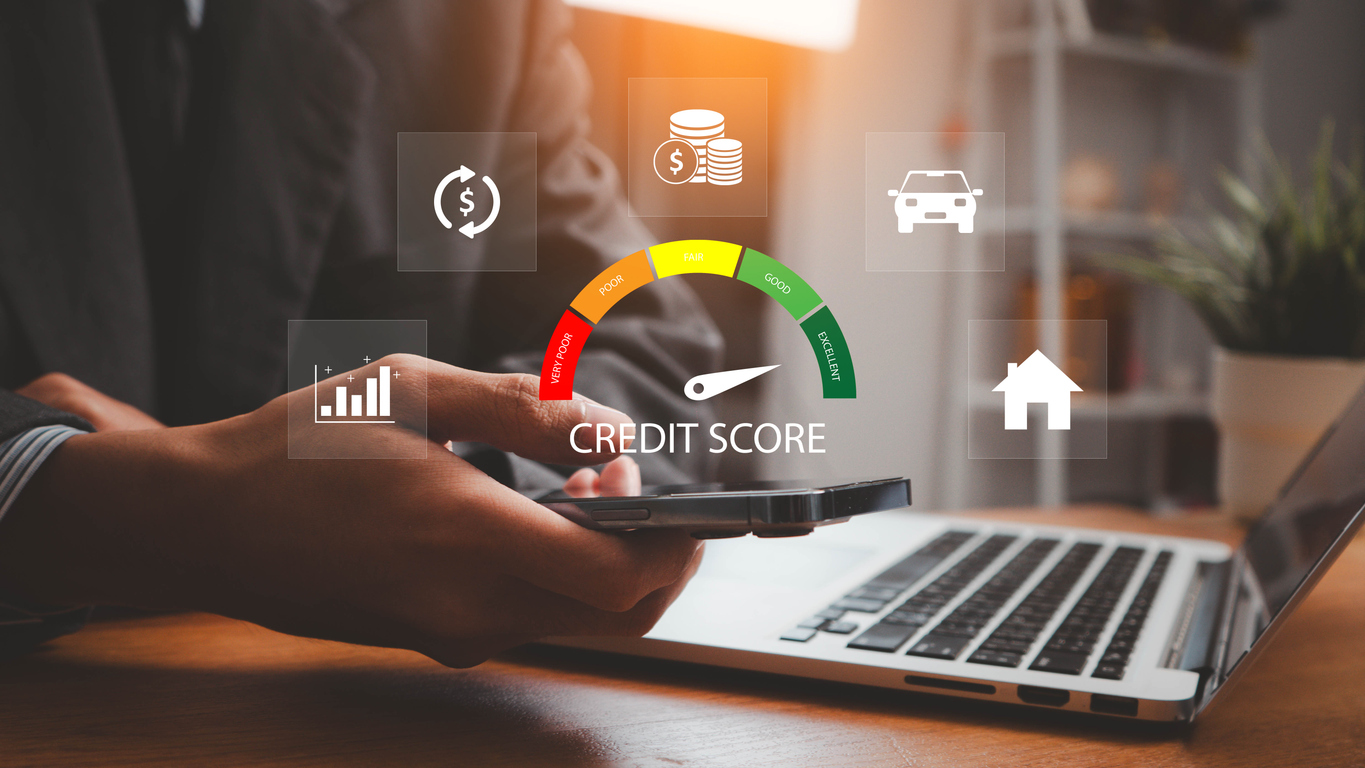 Someone on laptop evaluating statistical data with credit score icon.